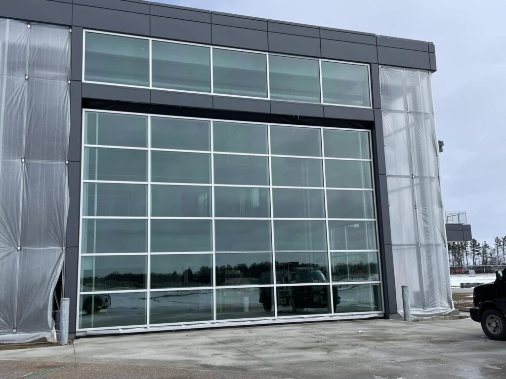 Largest Glass One-Piece Hydraulic Door in North America